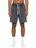 Person wearing gray shorts with a drawstring on a white background