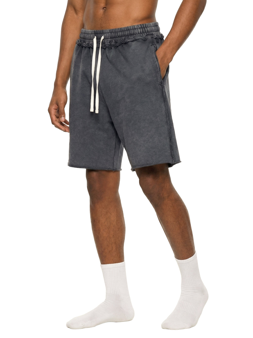 Person wearing gray shorts with a white drawstring on a white background
